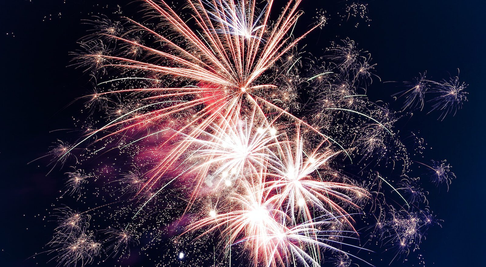 time lapse photography of fireworks at night
